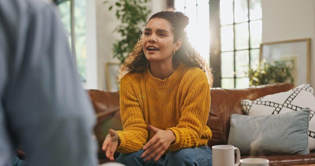 young woman speaking at a counseling session